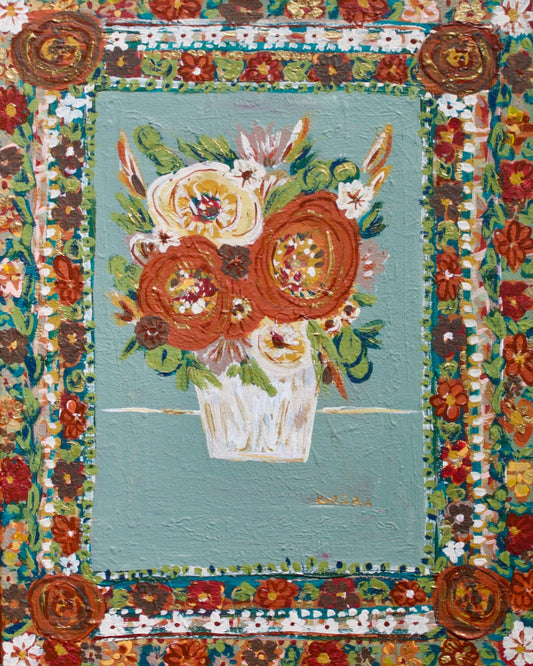 Decorative floral panel with intricate design on a stand against a natural background